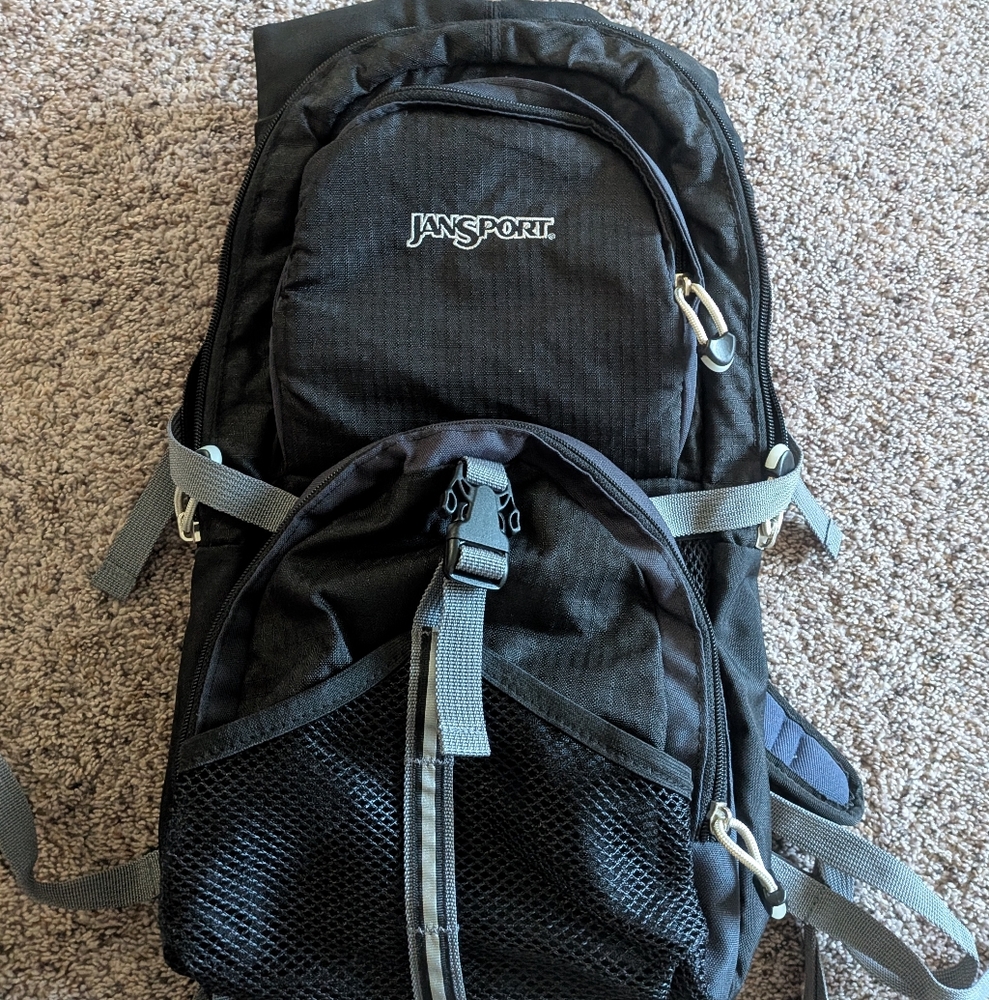 Jansport Black Backpack with Gray Accents Will Hold Water Sleeve Never Used